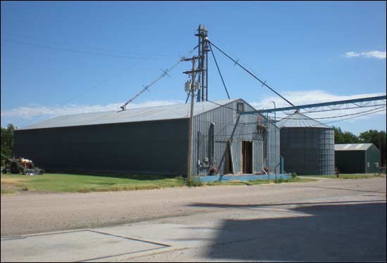 The long storage building stores grain piped over Pawnee Avenue from the main elevatorin Pawnee Rock. Photo copyright 2012 by Leon Unruh.