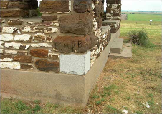 Hand-carved historical memories decorate the Pawnee Rock State Park pavilion, which was built in 1920. Photo copyright 2010 by Leon Unruh.