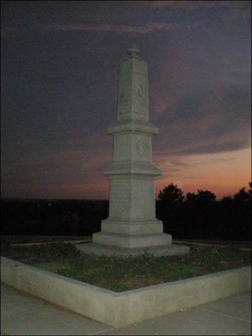 This summer a work crew laid sidewalk on the Rock and rebuilt the concrete wall around the base of the monument. The previous, shorter wall had crumbled over the decades. Photo copyright 2010 by Leon Unruh.