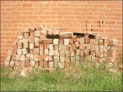 Brick pile by brick wall, Pawnee Rock. Copyright 2006 by Leon Unruh.