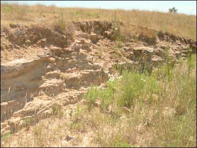 The clay pit in a draw on the former Unruh family farm. Photo copyright 2006 by Leon Unruh.