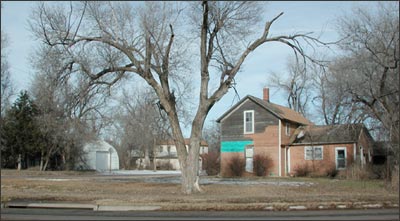 The old Drake house, viewed from the south in 2005. At one time, a Skelly gas station blocked this view. Photo copyright 2005 by Leon Unruh.