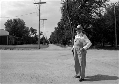 Elgie Unruh stands in Santa Fe Avenue near the Christian Church and his home (unseen). Photo copyright 2008 by Leon Unruh.