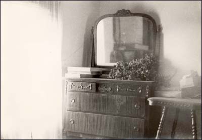 A dresser in the Otis and Lena Unruh farmhouse. Copyright 1974 by Leon Unruh.