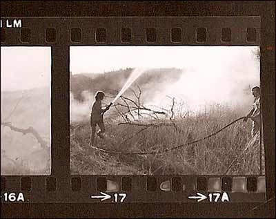 A Pawnee Rock teenager helps fight a grass fire not far from town in the 1970s. Photo copyright 1974 by Leon Unruh.