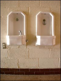 Fountain and wall-hanging spittoon at Pawnee Rock school building. Photo copyright 2007 by Leon Unruh.