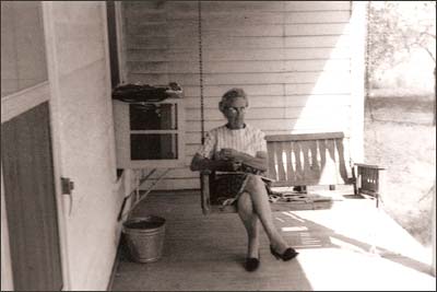 Lena Unruh on her porch, mid-1970s. Photo copyright 2007 by Leon Unruh.