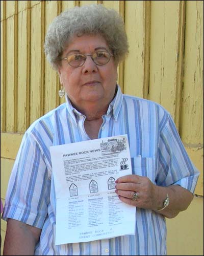 LaWanda Hendricks in 2006 with a copy of the Pawnee Rock News. Photo copyright 2006 by Leon Unruh.