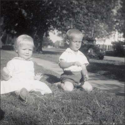 Cheryl and Leon in the front yard, 1960.