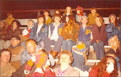 Greg Davidson, Marla Schultz, and others at a Macksville High School football game. Photo copyright 1972 by Leon Unruh.