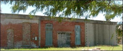Back of the 1908 Lindas building in Pawnee Rock, August 2006. Photo copyright 2006 by Leon Unruh.