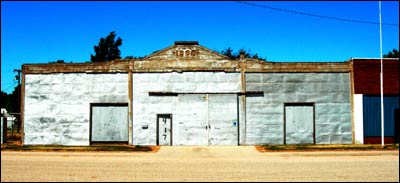 Back of the 1908 Lindas building in Pawnee Rock, August 2006. Photo copyright 2006 by Leon Unruh.
