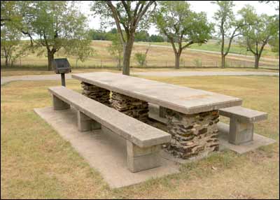 Picnic table on the north slope of Pawnee Rock. Photo copyright 2006 by Leon Unruh.