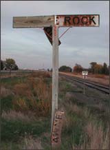 Pawnee Rock sign along the Santa Fe tracks. Photo copyright 2003 Leon Unruh.