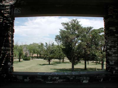 View of the trees on the north side of Pawnee Rock State Park, as seen from inside the park's pavilion. Photo copyright 2005 by Leon Unruh.