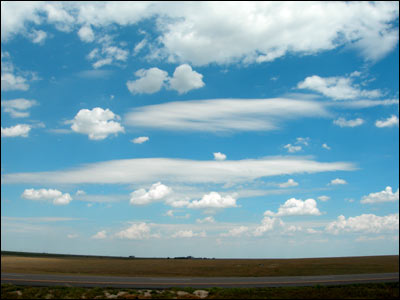 Afternoon clouds over western Kansas and I-70. Photo copyright 2008 by Leon Unruh.