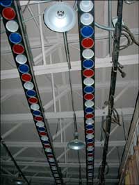 Lights above the auditorium stage in the Pawnee Rock school lunchroom. Photo copyright 2006 by Leon Unruh.