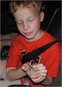 Sam with a toad. Copyright 2005 Leon Unruh.