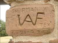 Someone from Sherman, Texas, scratched initials in the Rock's pavilion in 1923. Copyright 2006 by Leon Unruh.