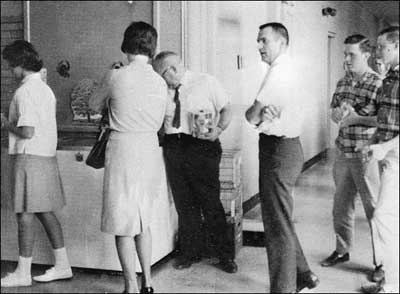 Karen Miller, Faye (Wilson) Steffen, H.A. Smith, Clifford Riddle and another boy line up by the cooler.