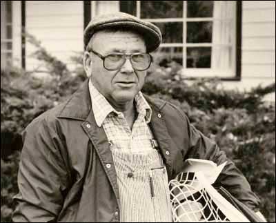 Elgie Unruh in front of the house he built. Photo copyright Leon Unruh.