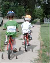Boys on bikes in Pawnee Rock. Photo copyright 2002 Leon Unruh.