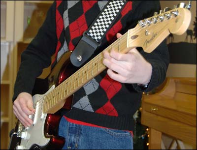 Nik plays the guitar. Photo copyright 2008 by Margaret Unruh.