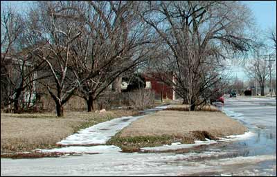 Intersection and sidewalk at Santa Fe Avenue and Rock Street in Pawnee Rock. Photo copyright 2008 by Leon Unruh.