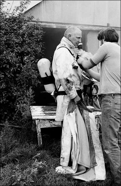 Tom Flick and Doug Flick at a fire near Pawnee Rock, mid-1970s. Photo copyright 1974 by Leon Unruh.