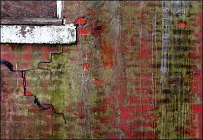 Ice on the old fire station's back wall. Photo copyright 2005 by Leon Unruh.