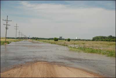 High water from Ash Creek crosses the road south of Pawnee Rock. Jim Dye made this photo in mid-June. Photo copyright 2009 by Jim Dye.
