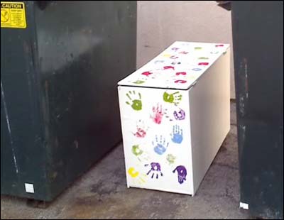 Hand-painted cabinet left with the trash at the end of the school year at Ravenwood Elementary School, Eagle River, Alaska. Photo copyright 2009 by Leon Unruh.
