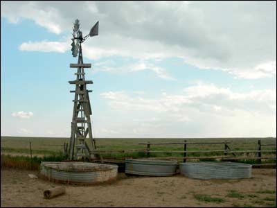 Windmill in western Kansas, August 2006. Photo copyright 2006 by Leon Unruh.