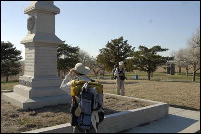 Jerry and Karen explore the monument atop Pawnee Rock State Park. Jim Dye made this photo on April 3, 2011. Photo copyright 2011 by Jim Dye.