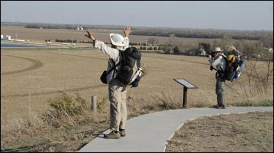 The California couple carries enough gear to spend the night outdoors and cook their own food. Jerry Bowerman and Karen Clark, coast-to-coast hikers. Jim Dye made this photo on April 3, 2011. Photo copyright 2011 by Jim Dye.