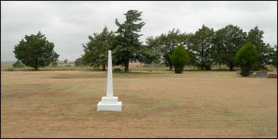 Pawnee Rock's Memorial Day services are held at this monument in the center of the cemetery. Photo copyright 2006 by Leon Unruh.