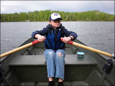 Nik rows across Kepler Lake, Alaska. Photo copyright 2009 by Leon Unruh.