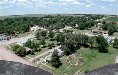 View of Pawnee Rock northwest of the Farmers Grain elevator. Photo copyright 2006 by Leon Unruh.