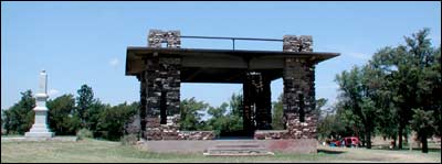 Pavilion atop the Rock, with the monument and trees, photographed from the east. Photo copyright 2008 by Leon Unruh.