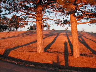 Pawnee Rock and my shadow at sunset, January 2005. Copyright 2005 Leon Unruh.