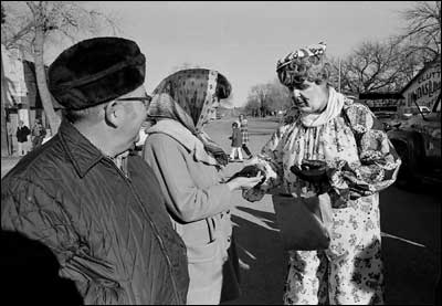 A clown also brightened the day. He speaks here to a woman who I think I Dorothy Bowman. Photo copyright 2008 by Leon Unruh.