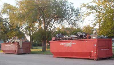 Two bins of trash collected by Pawnee Rock residents during the citywide cleanup await hauling at the city park. Gary Trotnic, one of the volunteers, took this photo. Photo copyright 2007 by Gary Trotnic.