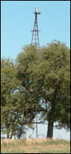 The windmill in the yard of Otis and Lena Unruh's farm. Photo copyright 2006 by Leon Unruh.